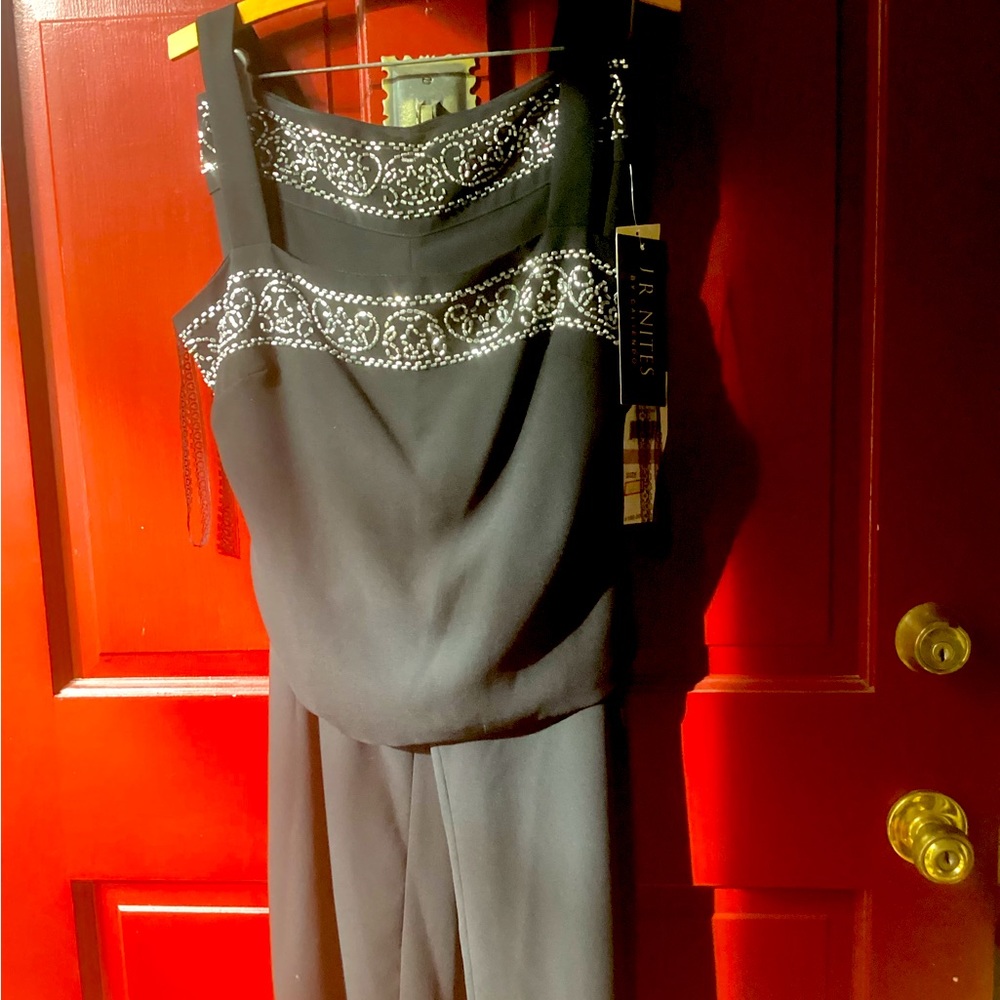 Beautiful black jumpsuit with silver embellishments,from Macys,brand new Sz 6